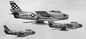 Photo of three North American F-86 Sabre Jets in flight.